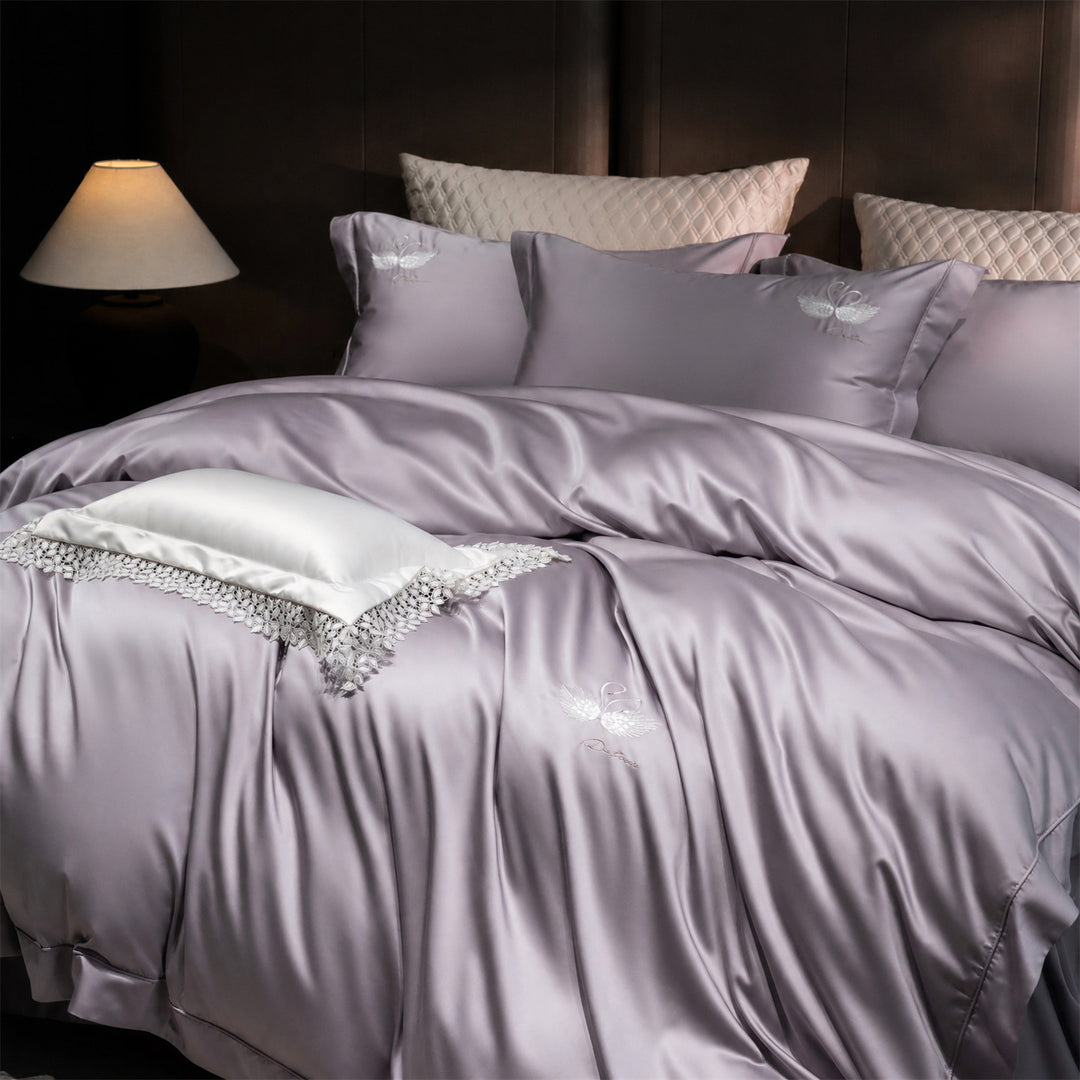 Luxurious satin bedding set with embroidered swan motif and lace pillow