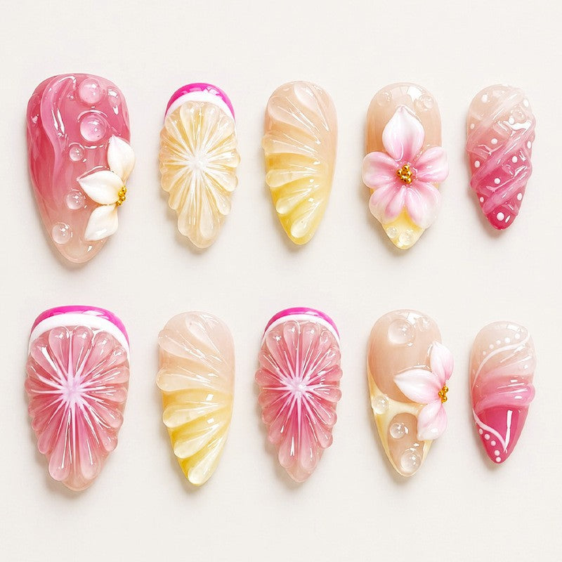 Artificial nail set with elegant floral details and glitter effects Stornfield