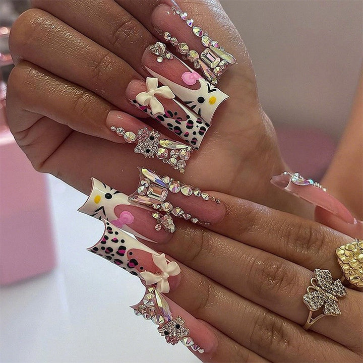 Glamorous artificial nail set with sparkling rhinestone embellishments and creative animal designs Stornfield