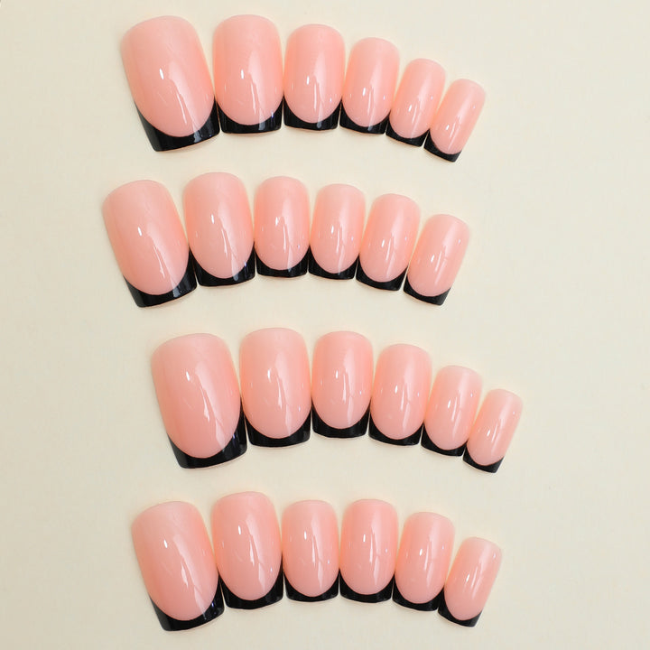 Artificial nail set with elegant French tip design and modern accents Stornfield