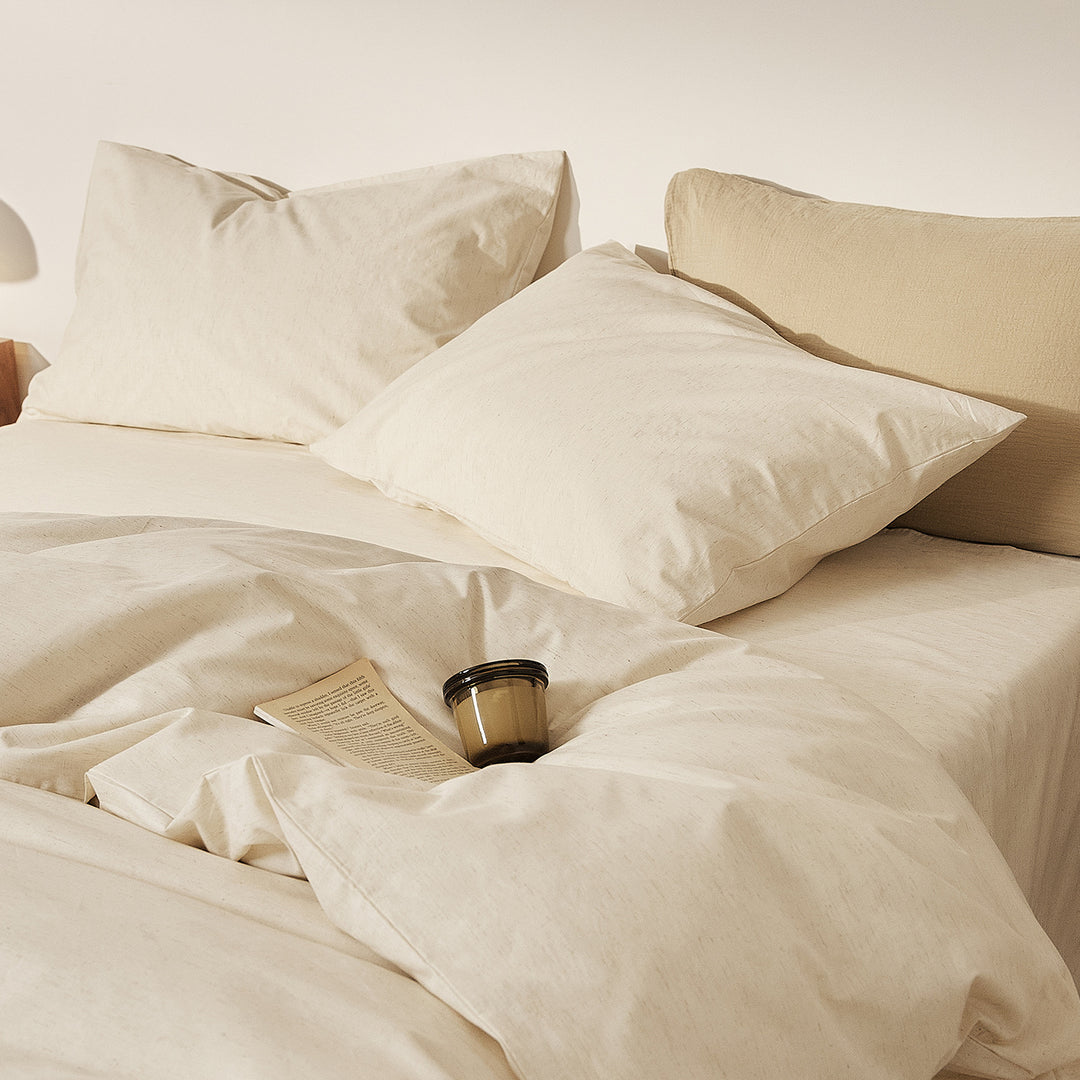 Linen bedding set with fine pinstripes and reversible function