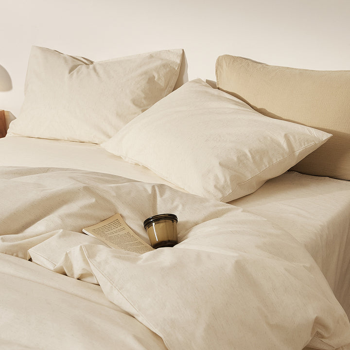 Linen bedding set with fine pinstripes and reversible function