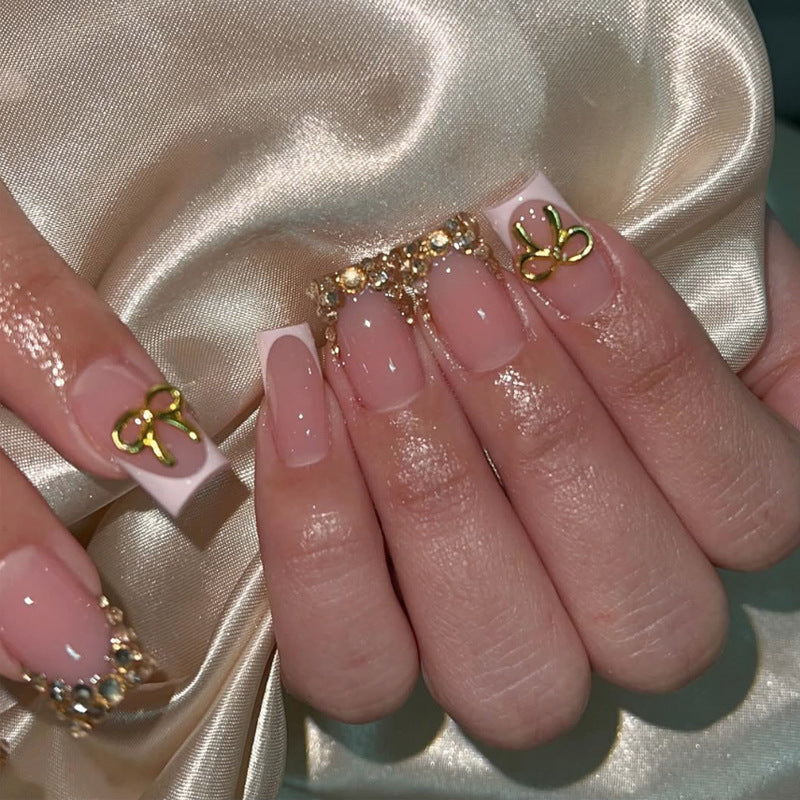 Artificial nail set with elegant gold embellishments Stornfield