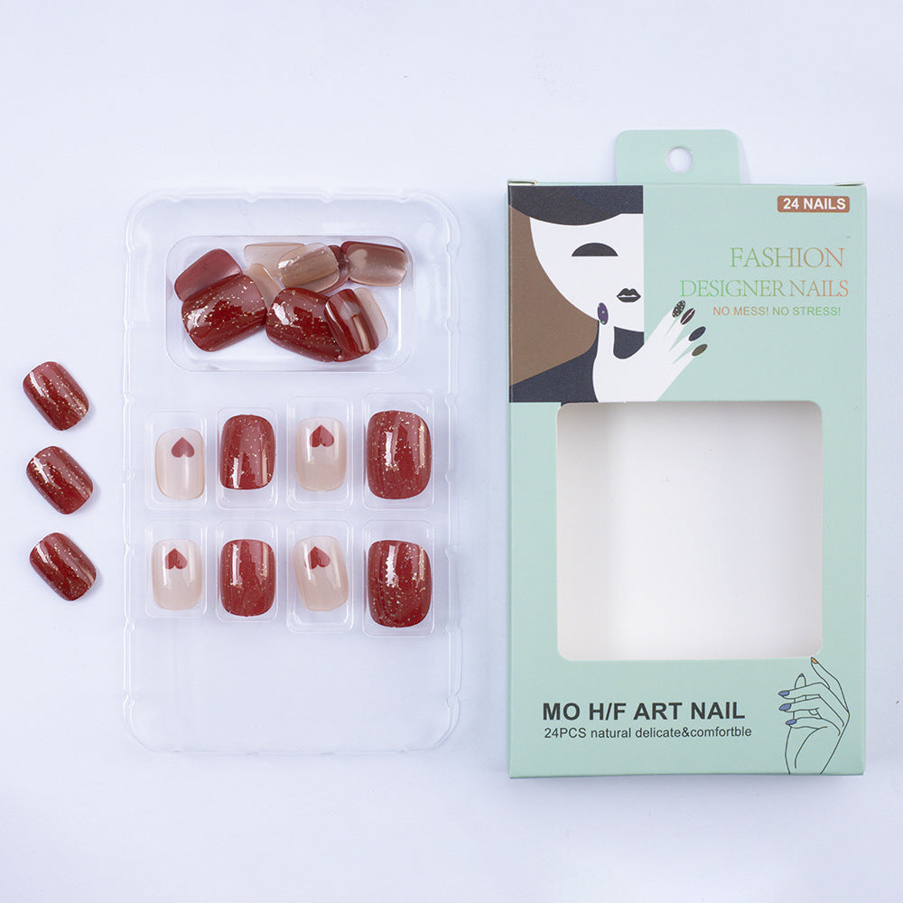 Art nail set with heart designs and glitter Stornfield