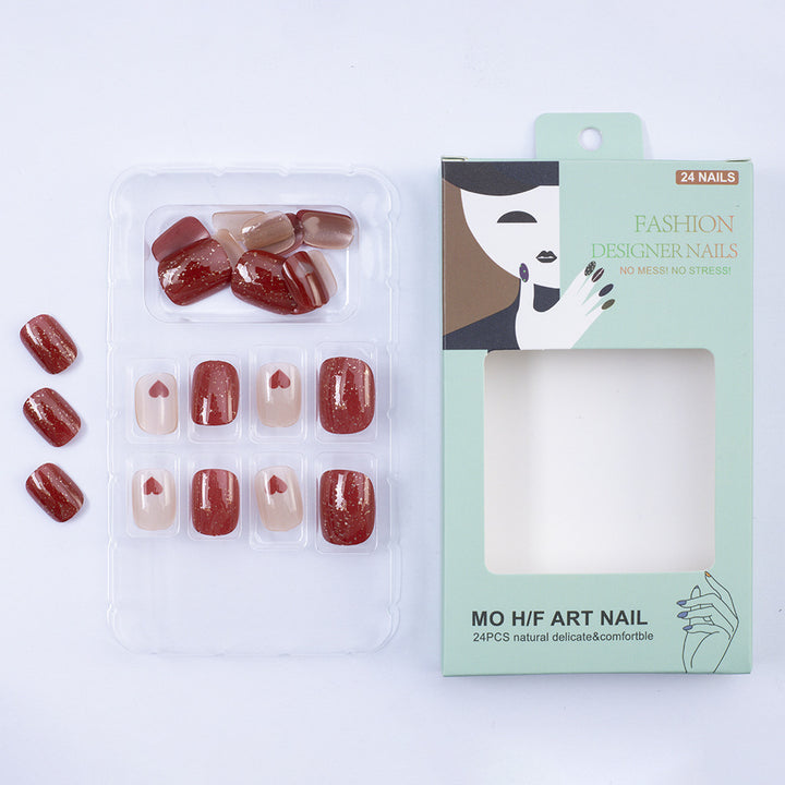 Art nail set with heart designs and glitter Stornfield