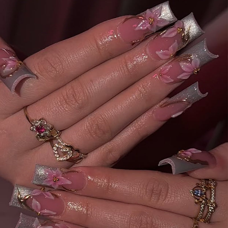 Elegant artificial nail set with floral designs and glitter accents Stornfield