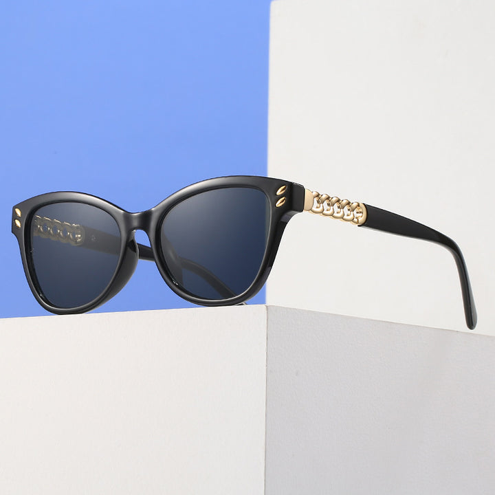 Ladies fashionable cat-eye sunglasses with luxurious chain accents Stornfield