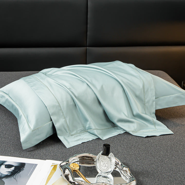 Luxurious satin cushion cover with decorative double piping