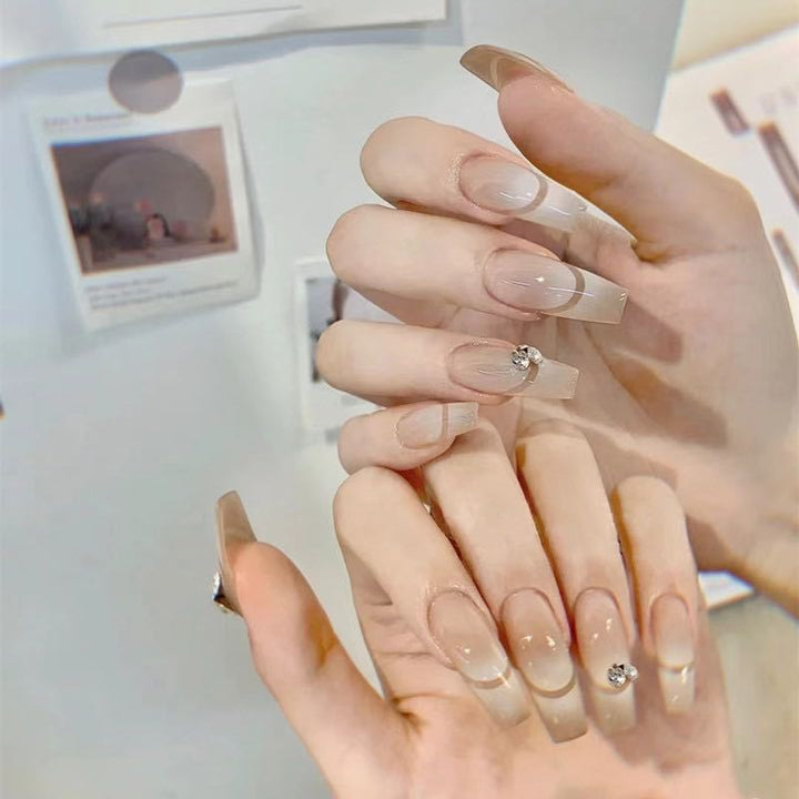 Glamorous artificial nails with elegant rhinestone decorations Stornfield