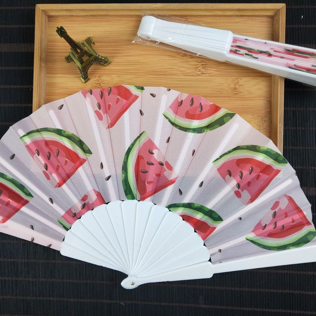 Women folding hand fan with shimmering scale pattern Stornfield