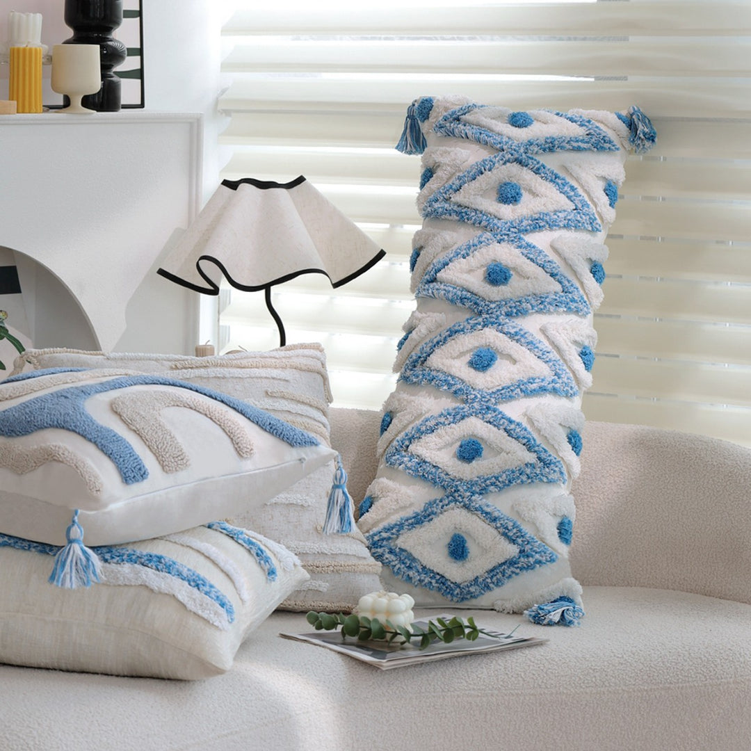 Square handwoven cushion cover made of cotton-linen with raised stripe tufting and corner tassels Stornfield