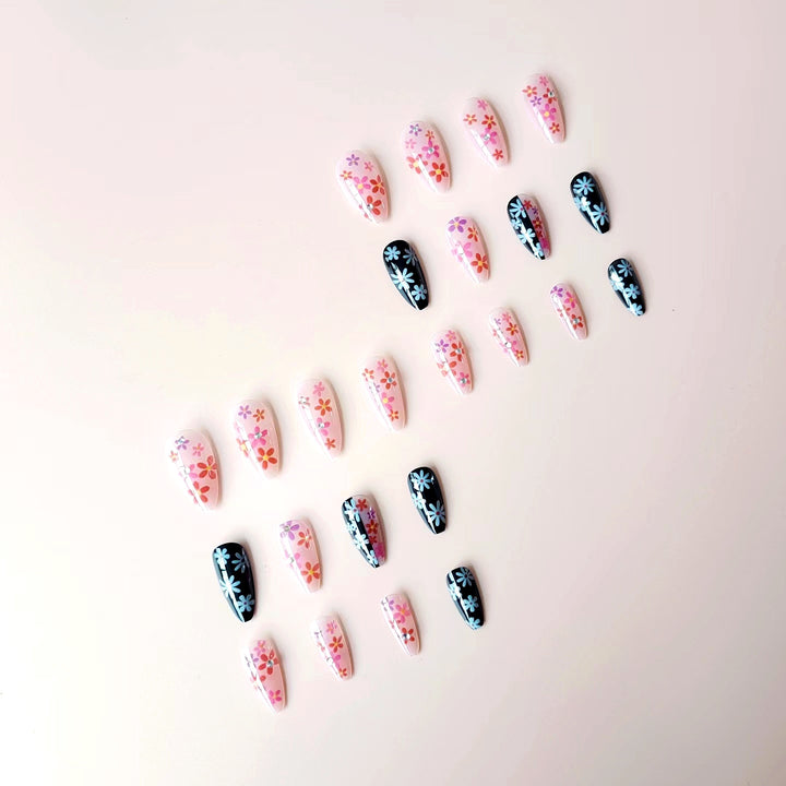 Artificial nail set with floral 3D embellishments and glitter accents Stornfield