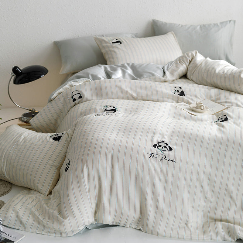 Quilted bed set with panda embroidery and fine stripe texture