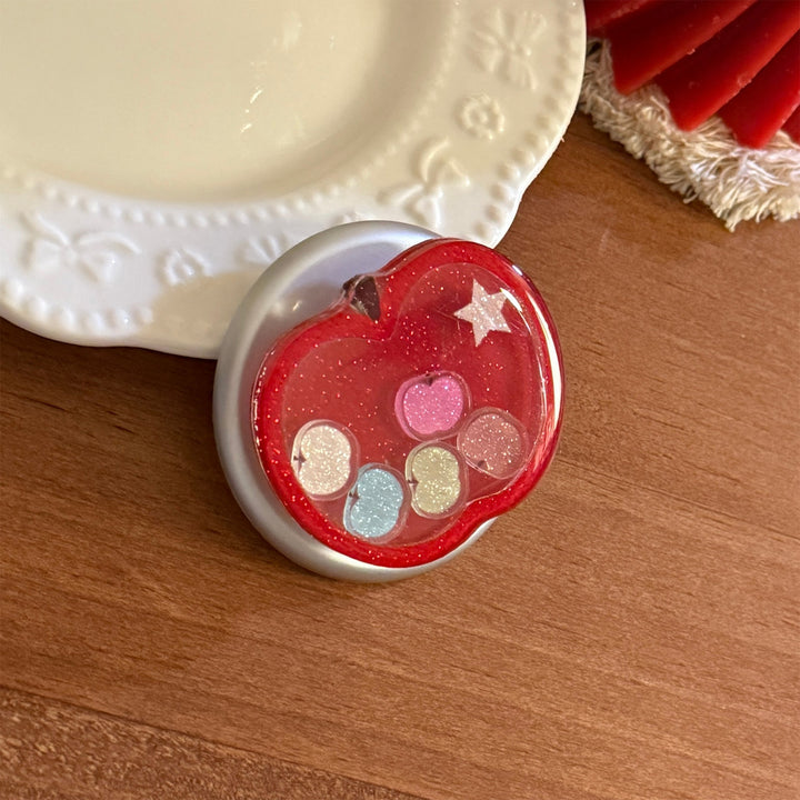 Funnier apple motif smartphone finger holder Stornfield