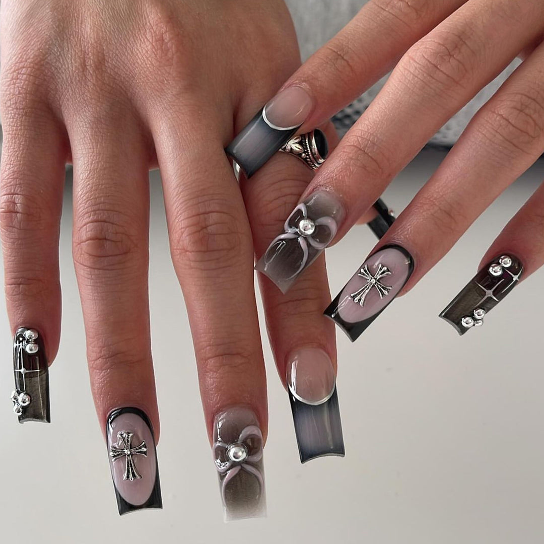 Artful acrylic nails with unique jewelry embellishments Stornfield