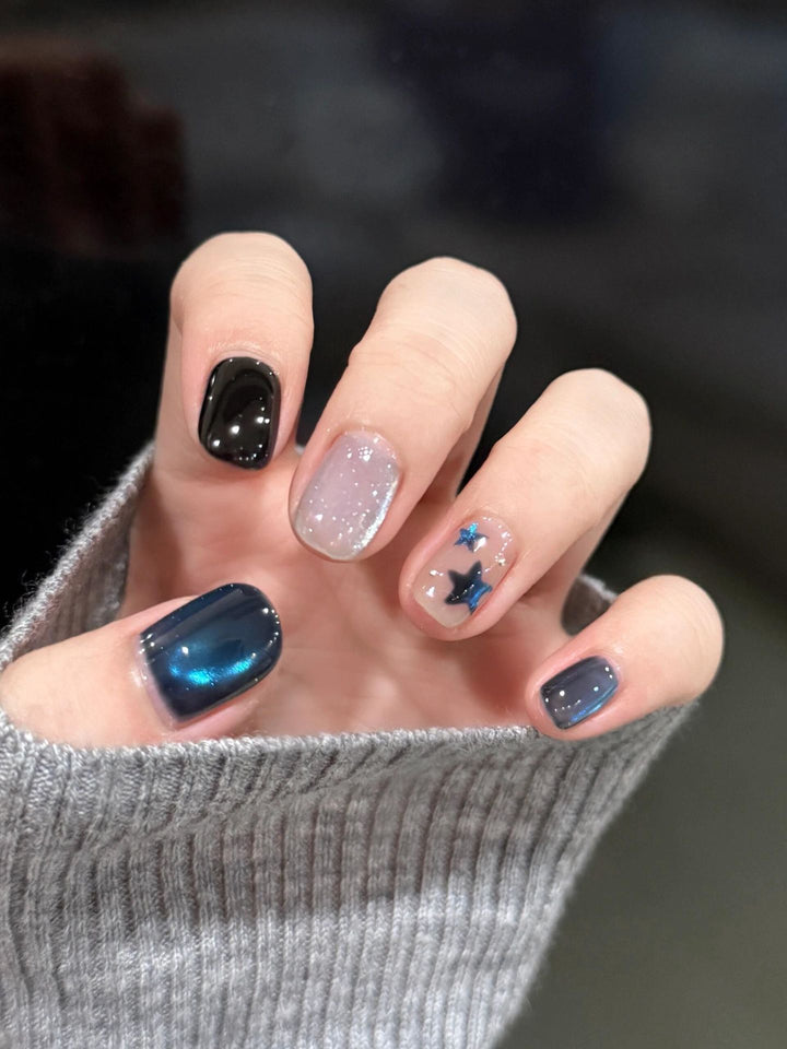 Artificial nails with elegant star design and shimmering effects Stornfield