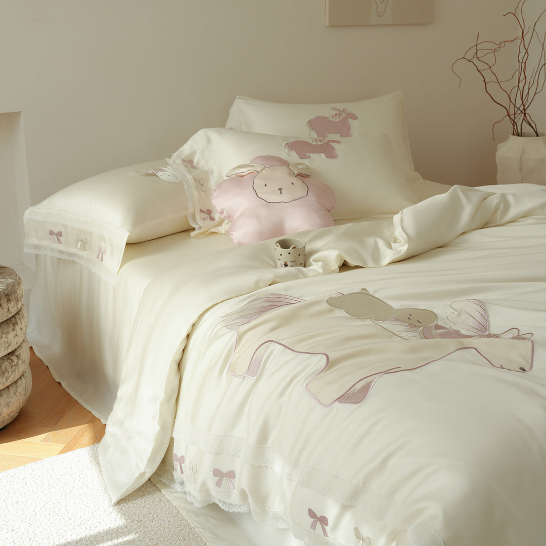 Child bedding set made of cotton satin with appliqués, ruffles, and cuddle pillow