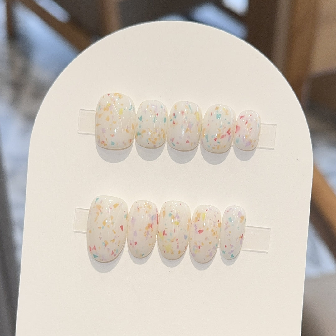 Artificial nails with cheerful sparkle design Stornfield