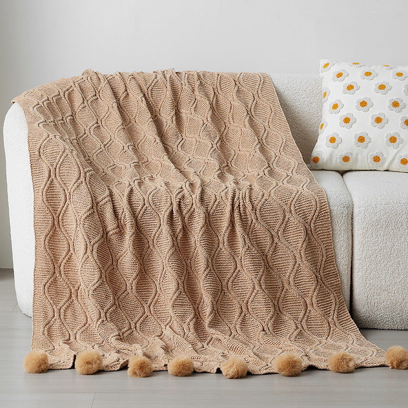 Ladies knit blanket with decorative pom poms Stornfield