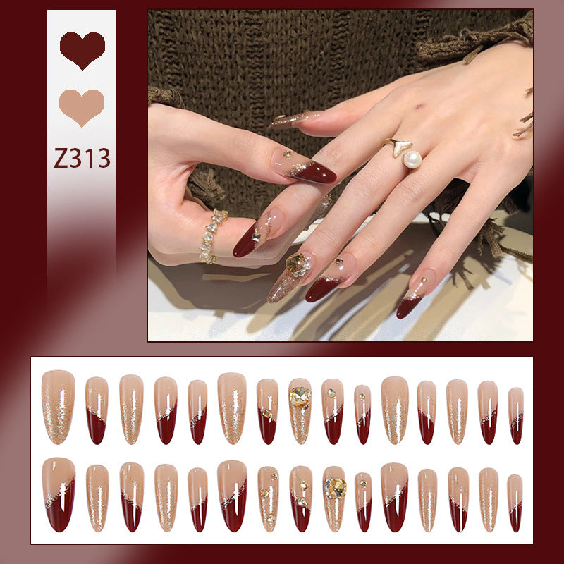 Acrylic nail set with elegant glitter design and exclusive embellishments Stornfield