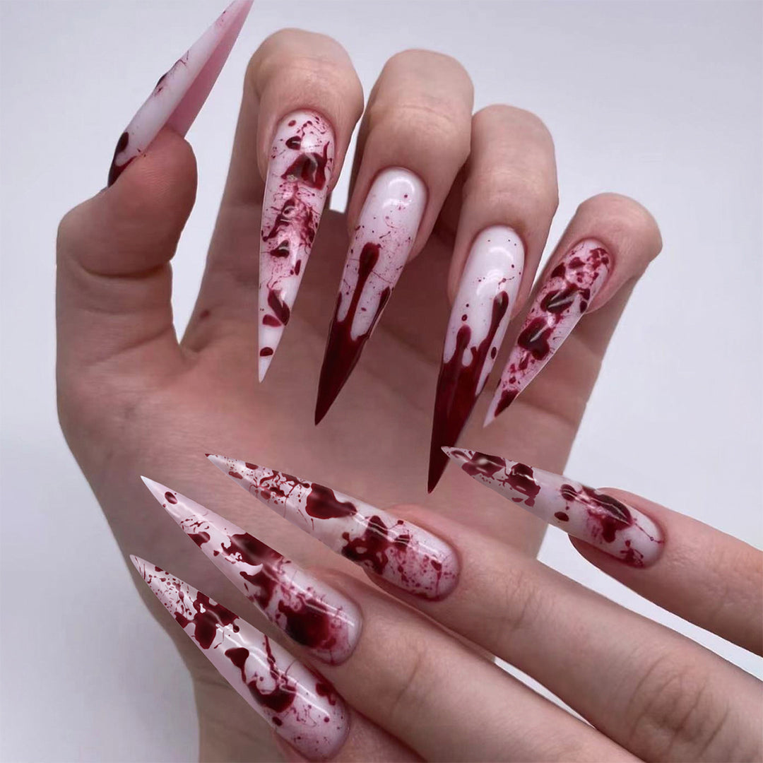 Creative Stiletto Nail Art with Blood Red Accents Stornfield