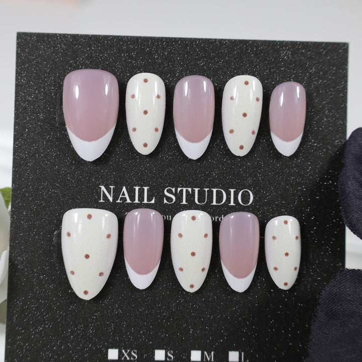 Artificial nails with elegant dots and glamorous accents Stornfield