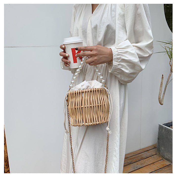 Women’s handbag with elegant pearl handle and braided design Stornfield