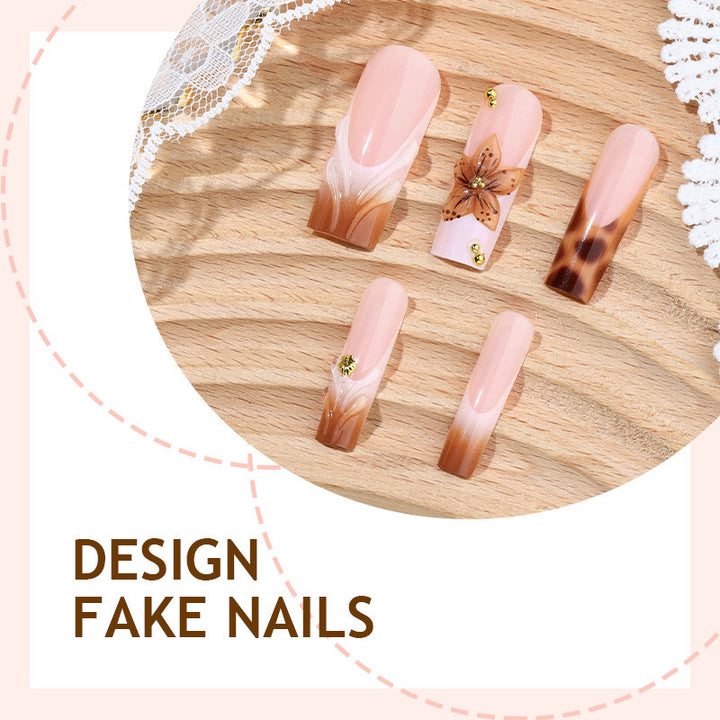 Creative nail art set with floral accents and ombre effect Stornfield