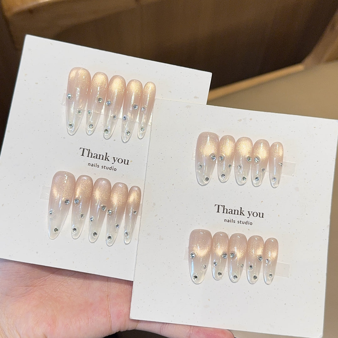 Artificial nails with shimmering accents and elegant rhinestone details Stornfield