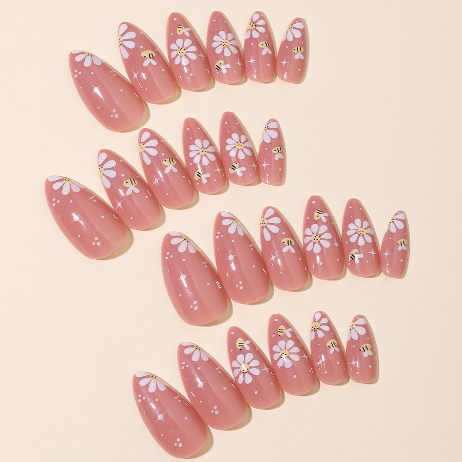 Artificial nails set with elegant flowers and glitter accents Stornfield