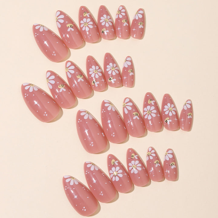 Artificial nails set with elegant flowers and glitter accents Stornfield