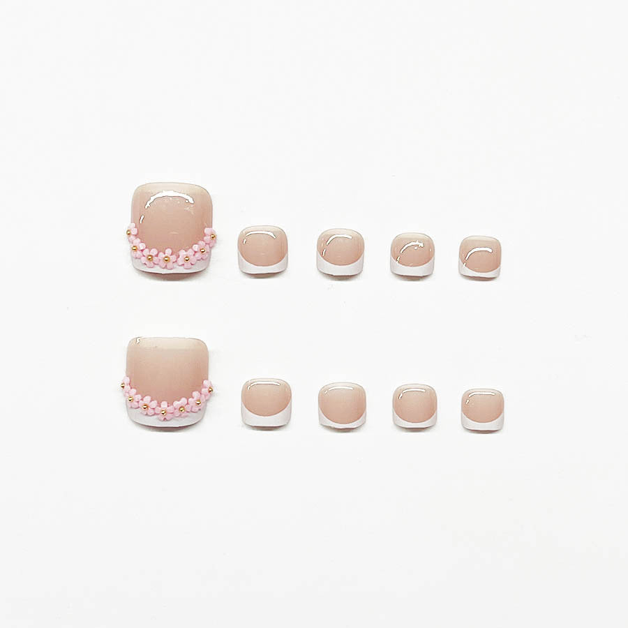 Nail art set with elegant French design and glamorous rhinestone accents Stornfield