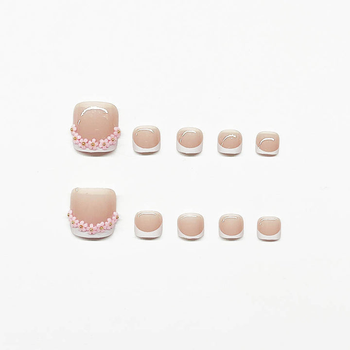 Nail art set with elegant French design and glamorous rhinestone accents Stornfield