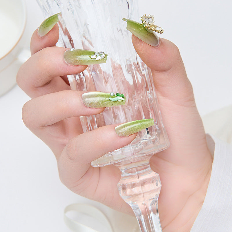Artificial nails with butterfly accents and glitter details Stornfield