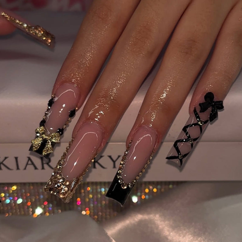 Glamorous artificial nails with jewelry accents Stornfield