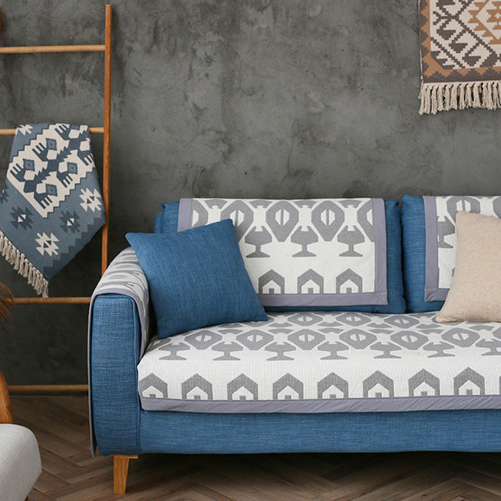 Washable non-slip sofa cover for three-seater couch with leaf pattern