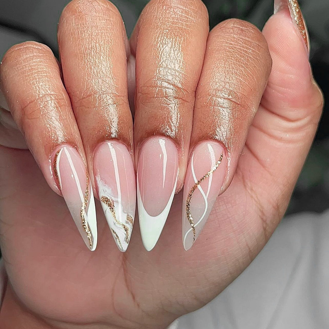 Artful stiletto nails with elegant marble and glitter design Stornfield