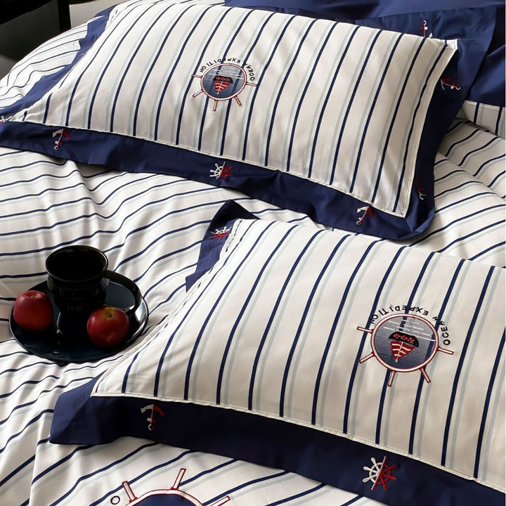 Maritime cotton satin bedding set with fine stripes, nautical embroidery, and reversible pillow