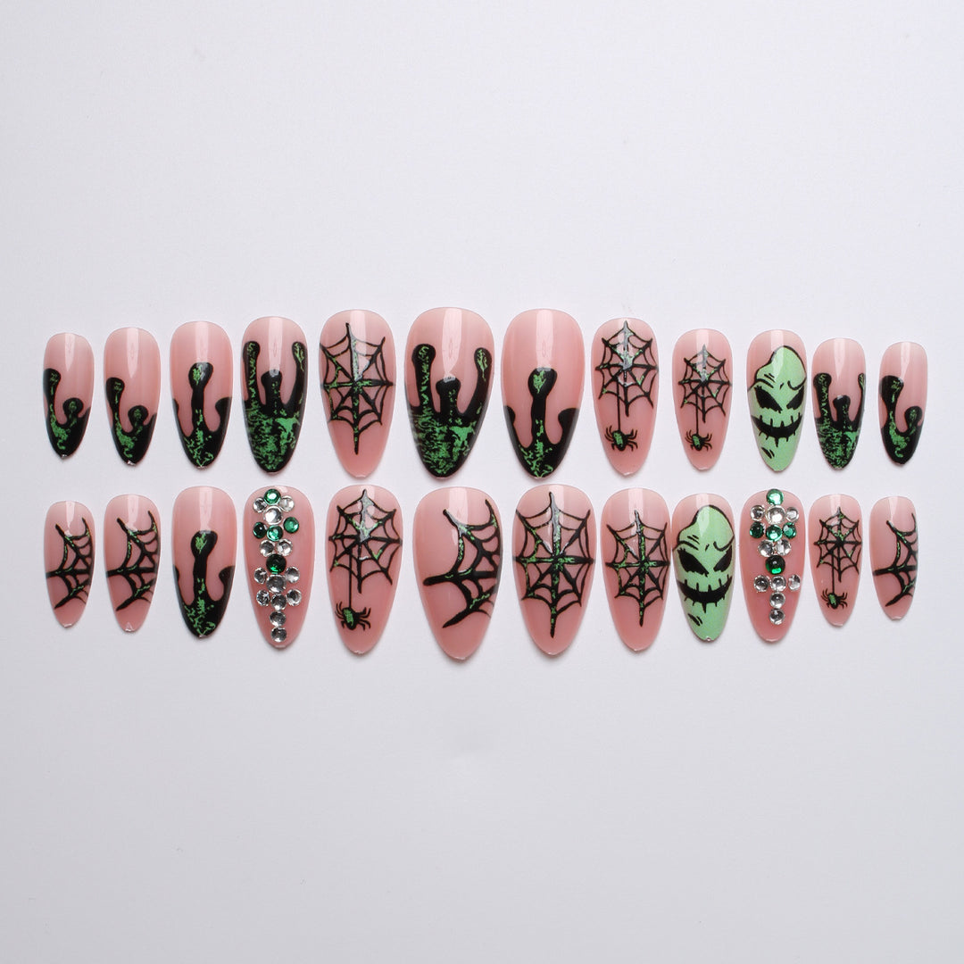 Acrylic nails with Halloween spider design and glitter accents Stornfield