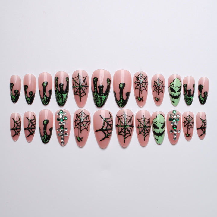 Acrylic nails with Halloween spider design and glitter accents Stornfield
