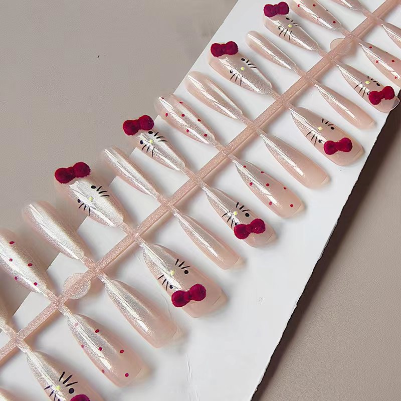Artificial nails with playful Hello Kitty design Stornfield
