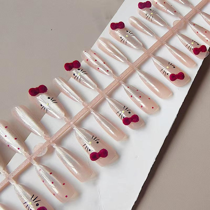 Artificial nails with playful Hello Kitty design Stornfield