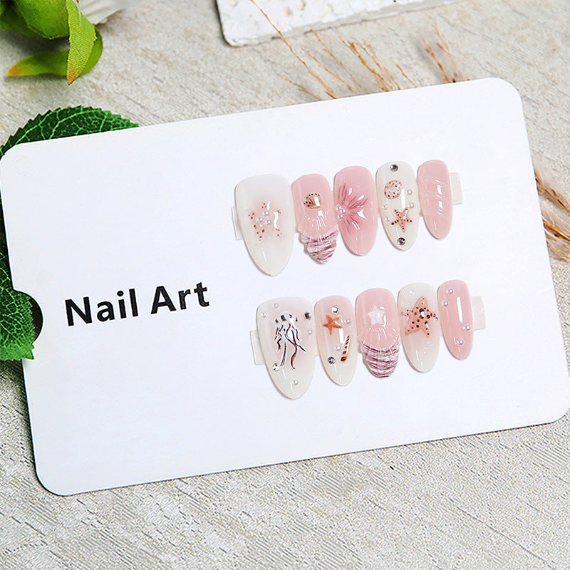 Artificial nails with maritime motifs and pearl embellishments Stornfield