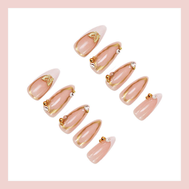 Artificial nail set with elegant gold accents and luxurious decorations Stornfield