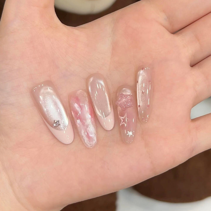 Artificial nails with delicate glitter and star motifs Stornfield