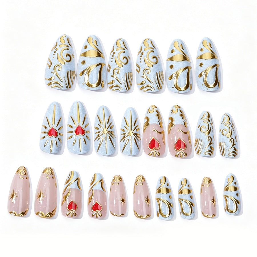 Artificial nail set with filigree golden accents and romantic heart motifs Stornfield