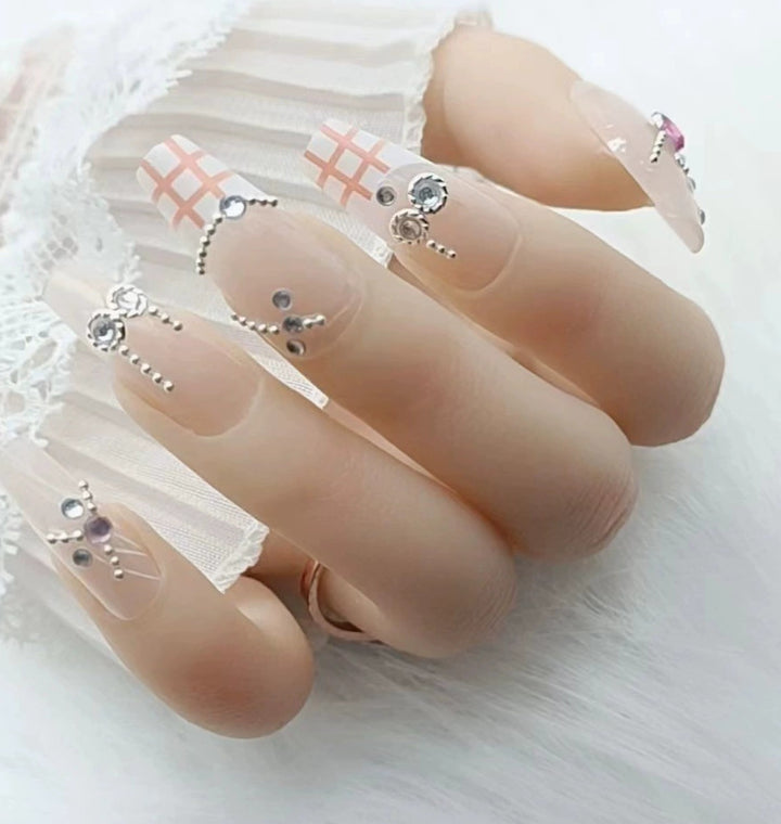 Elegant nail design with pearl embellishment Stornfield