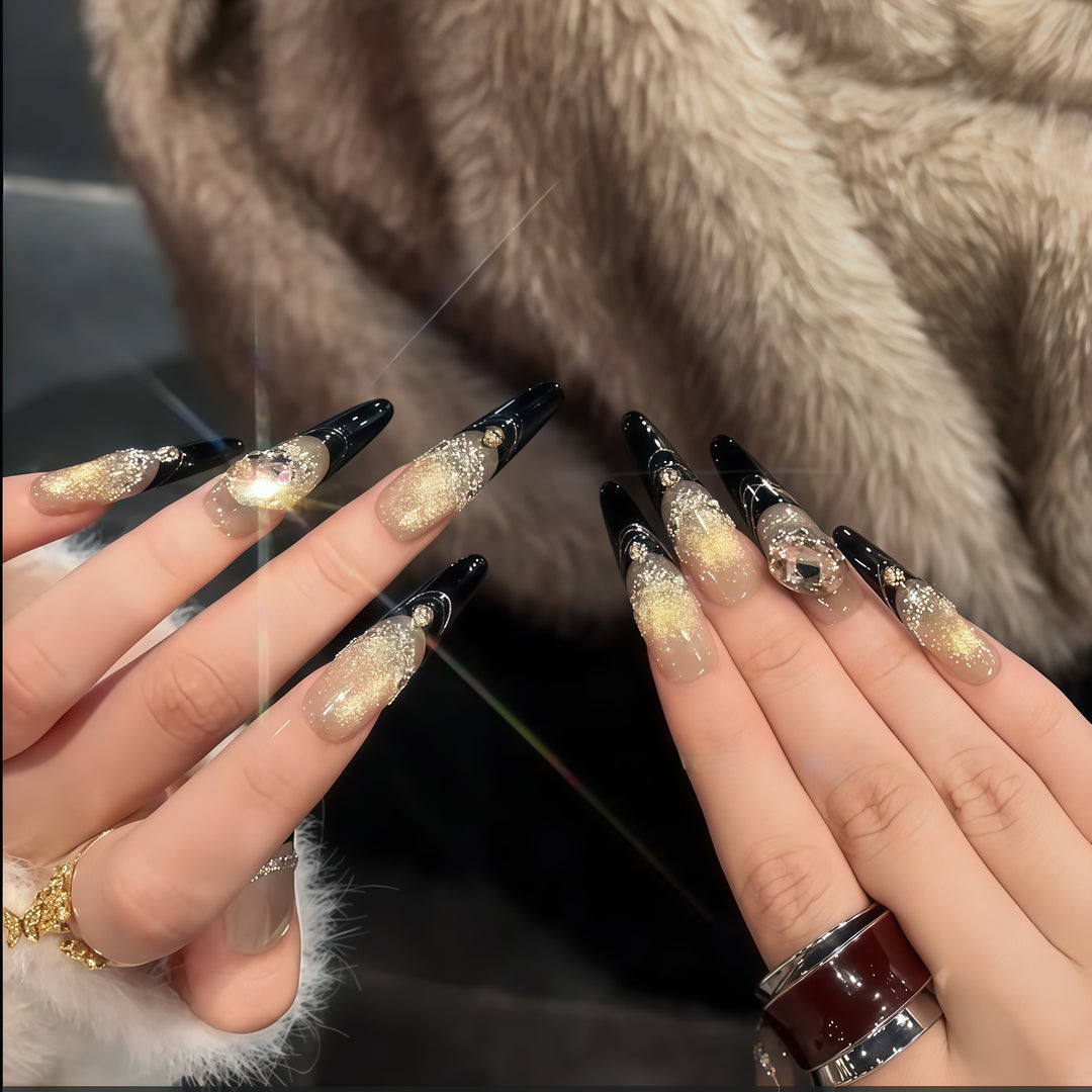 Glamorous artificial nails with extravagant rhinestone and glitter insets Stornfield