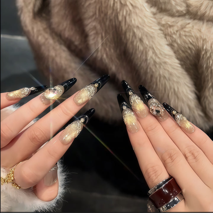 Glamorous artificial nails with extravagant rhinestone and glitter insets Stornfield