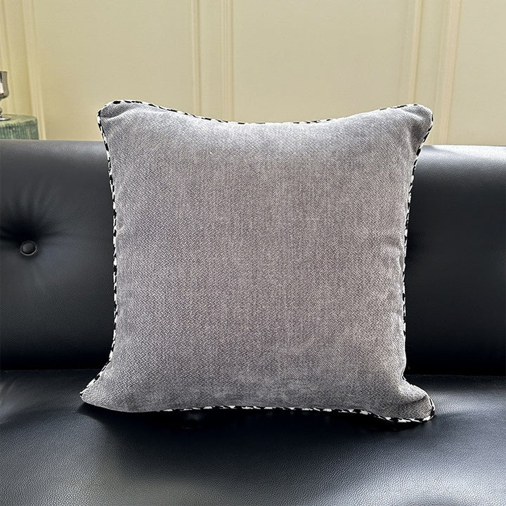 Decorative square decorative pillow made of soft velvet with contrasting piping